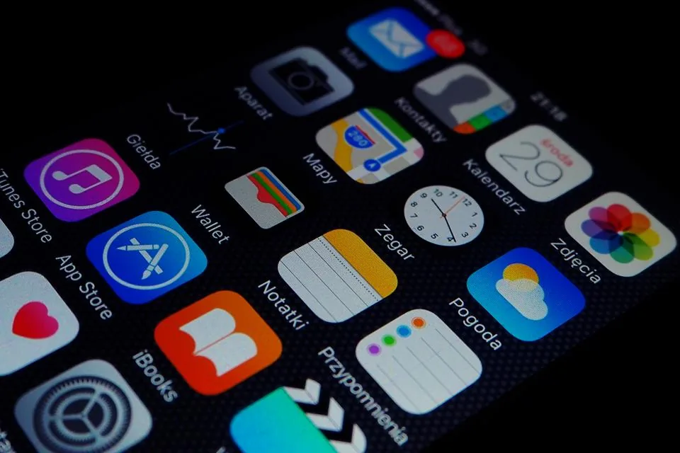 Woman holding a smartphone and reviewing privacy settings on the screen