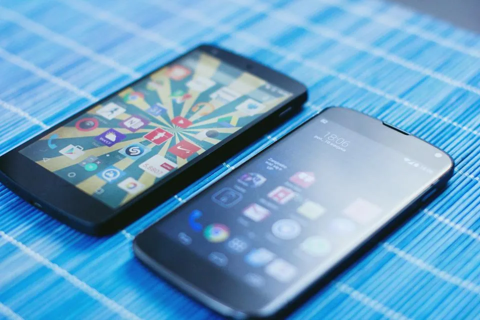 Two smartphones side by side on a table