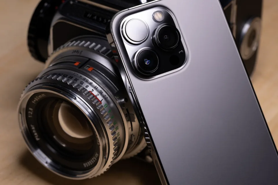 Smartphone screen showing a grid of photos with a lock symbol nearby